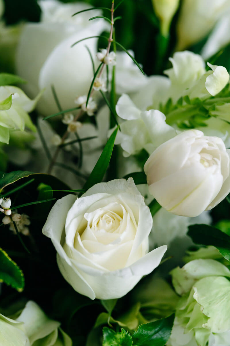 A timeless bouquet of fresh white blooms and natural greens
