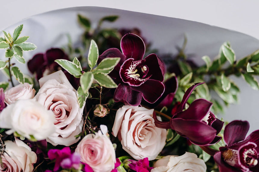 A bouquet of deep wine tones with pops of neutrals